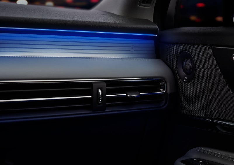 A thin available ambient blue lighting illuminates the pinstripe aluminum under an ebony dashboard, emitting a cool energy | Pierre Lincoln in Lynnwood WA