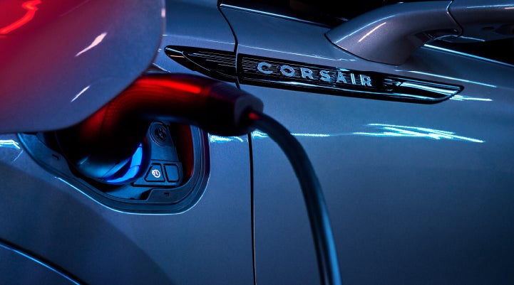 A charger plugged into the charging port of a 2024 Lincoln Corsair® Plug-in Hybrid model. | Pierre Lincoln in Lynnwood WA